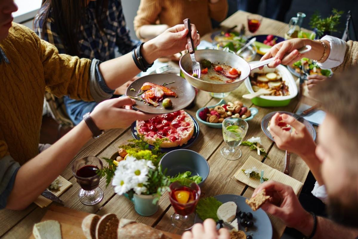 People sharing healthy foods around a table